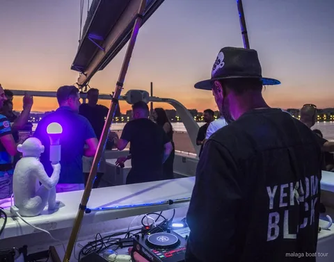 Catamaran with a live DJ during the Malaga sunset and night catamaran cruise