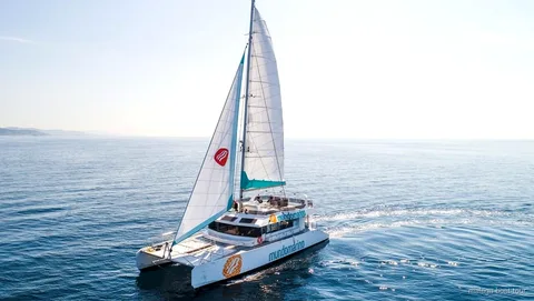Catamaran anchored for a swimming stop during the Malaga catamaran cruise with swimming
